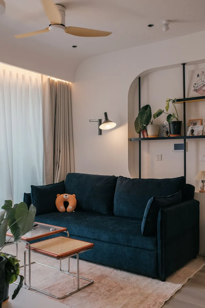 A finished living room with deep green walls