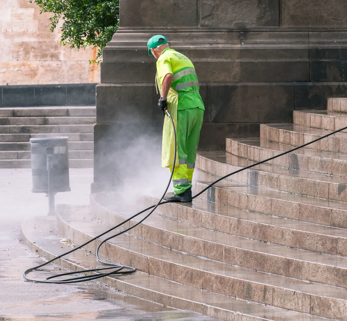 Surfaces being pressure washed before painting